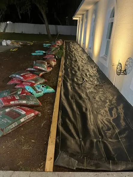 Bed prep with fabric and mulch on a Floral City property