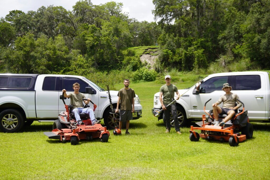 Tons Agricultural Services crew members together on a maintained property.