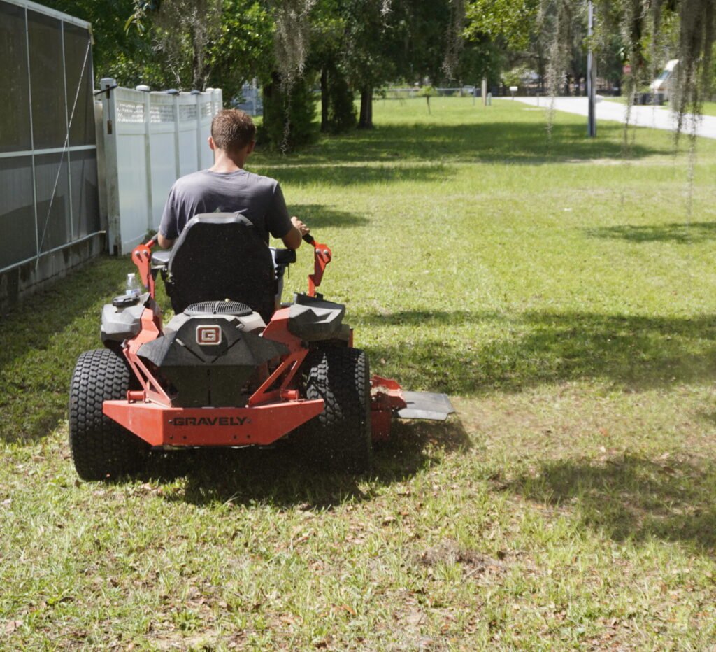 Maintained outdoor property area with neat lawn and landscape features.