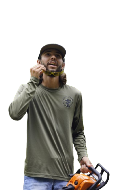 Crew member from Tons Agricultural Services standing with professional landscaping equipment.